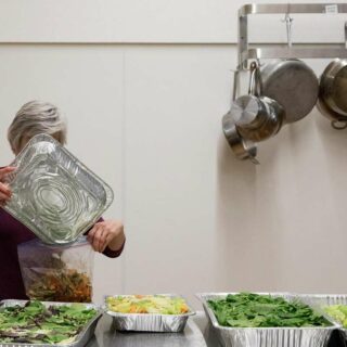BFN board member helps sort and store rescued food.